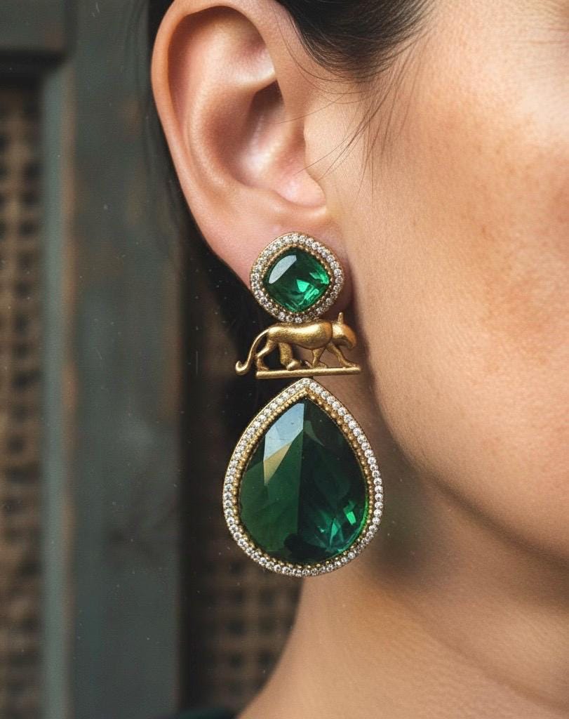 IZRA Sabyasachi inspired Emerald green earrings in antique matt gold finish, Indian fusion earrings in green colour, indo western jewelry
