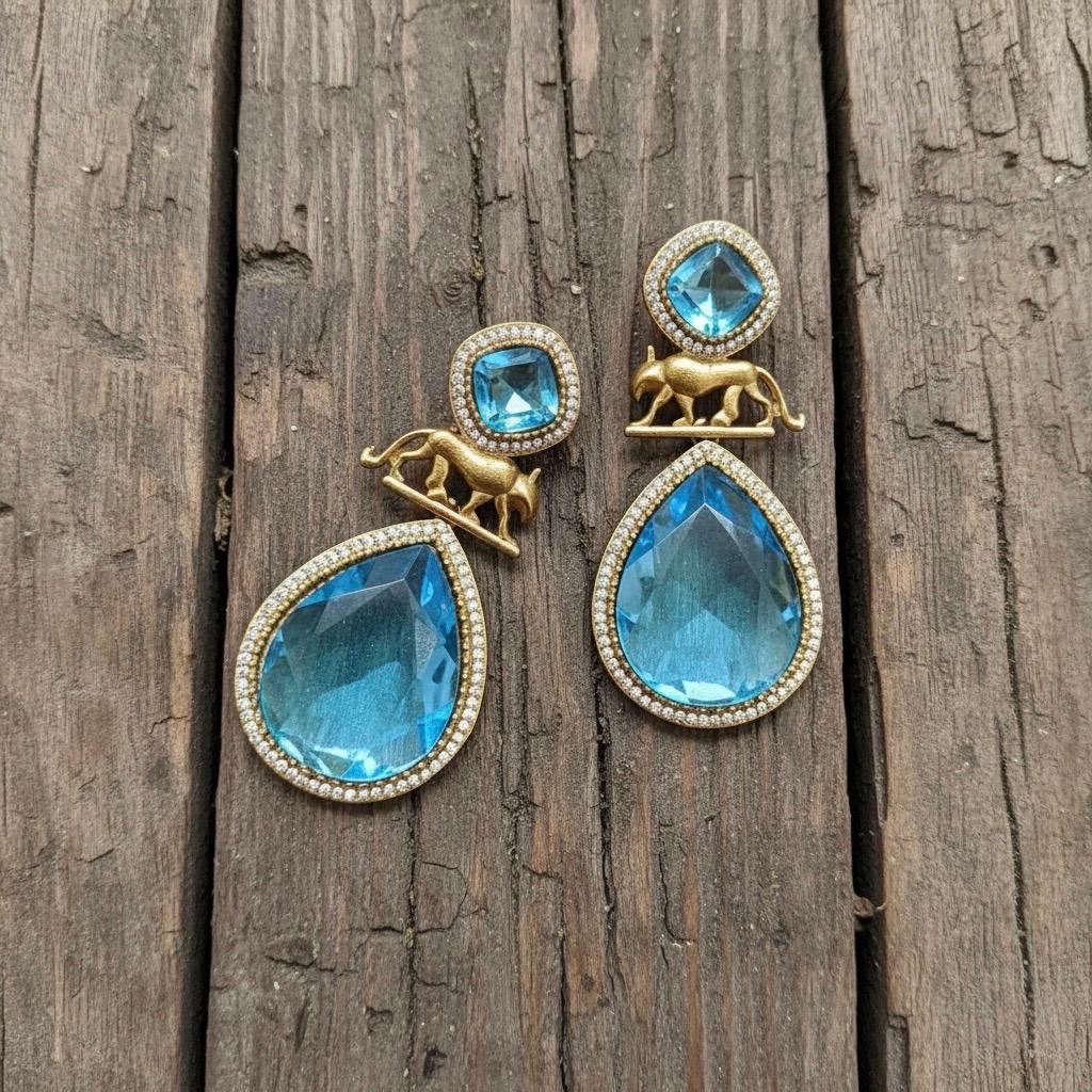 IZRA Sabyasachi inspired aqua/sky blue earrings in antique matt gold finish, Indian fusion earrings in aqua colour, indo western jewelry