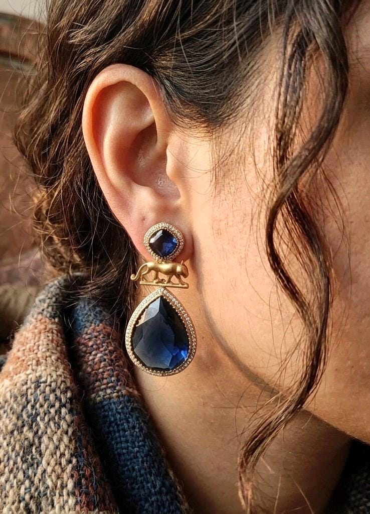 IZRA Sabyasachi inspired navy blue earrings in antique matt gold finish, Indian fusion earrings in navy blue colour, indo western jewelry
